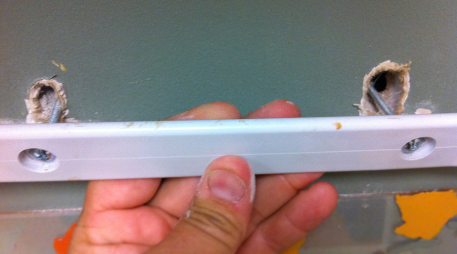 Paper towel holder fix put pressure on while screwing