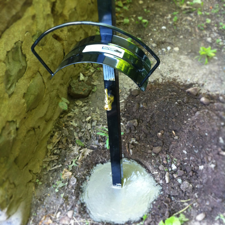 Installing an outdoor pole-mounted hose hanger with faucet