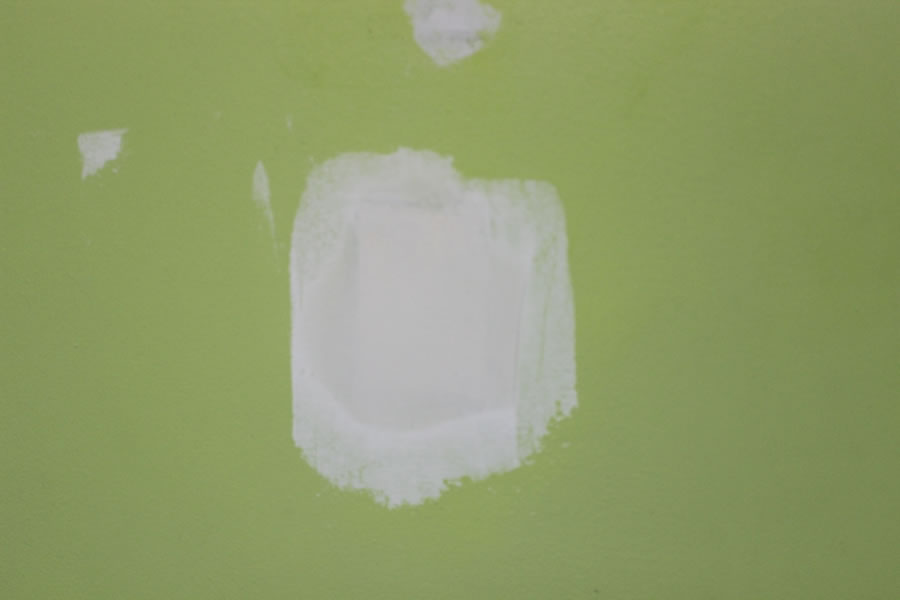 Skim walls with compound before you paint to smooth surface