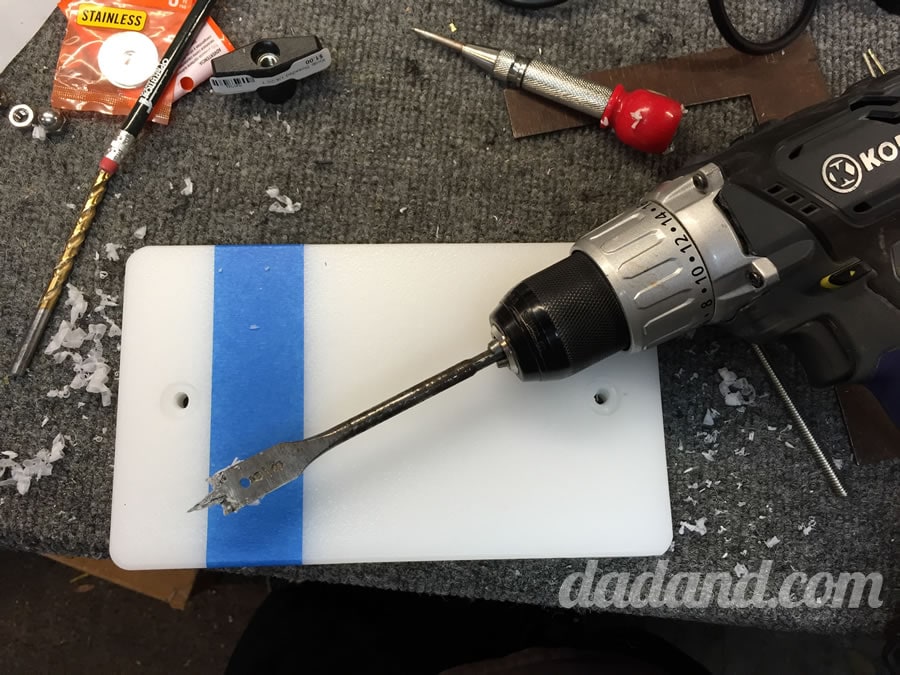 On the BOTTOM of ONE of the boards, I drilled about 1/8” into the board using a spade bit. This will allow the carriage bolt to be countersunk and sit flush with the bottom. Then drill a ¼” hole all the way through both boards on both sides.