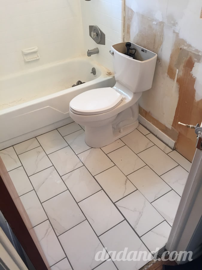 I gave the grout about 6 hours to setup and carefully installed the toilet and placed the vanity to get a feel for how it would come together.