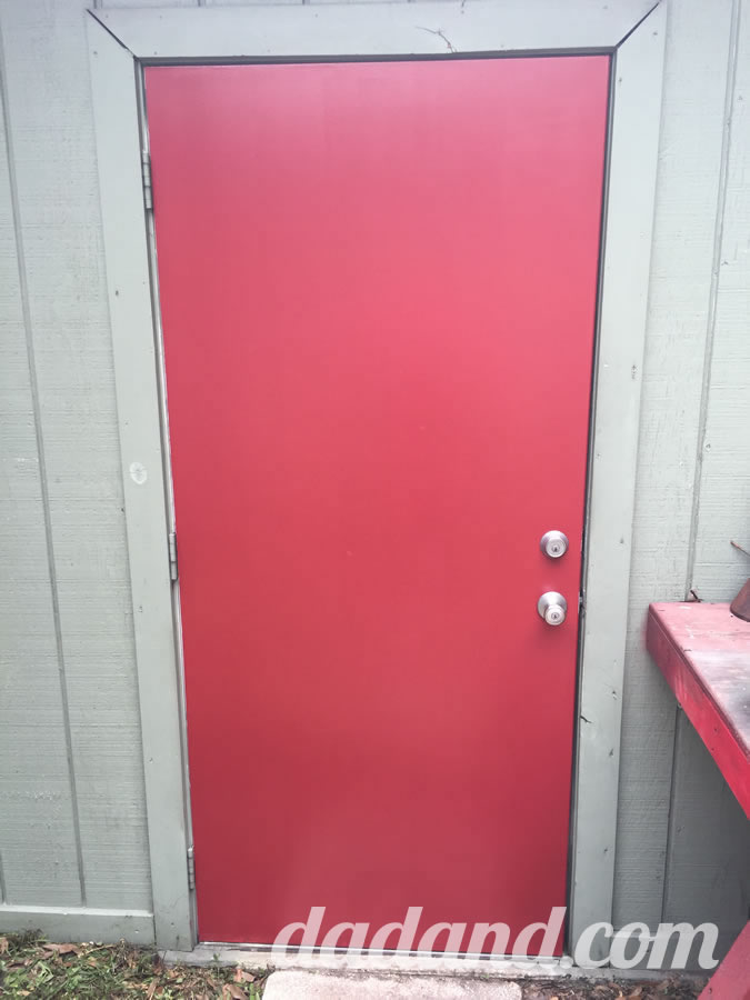Dad blog finishes painting a metal exterior door with paint.