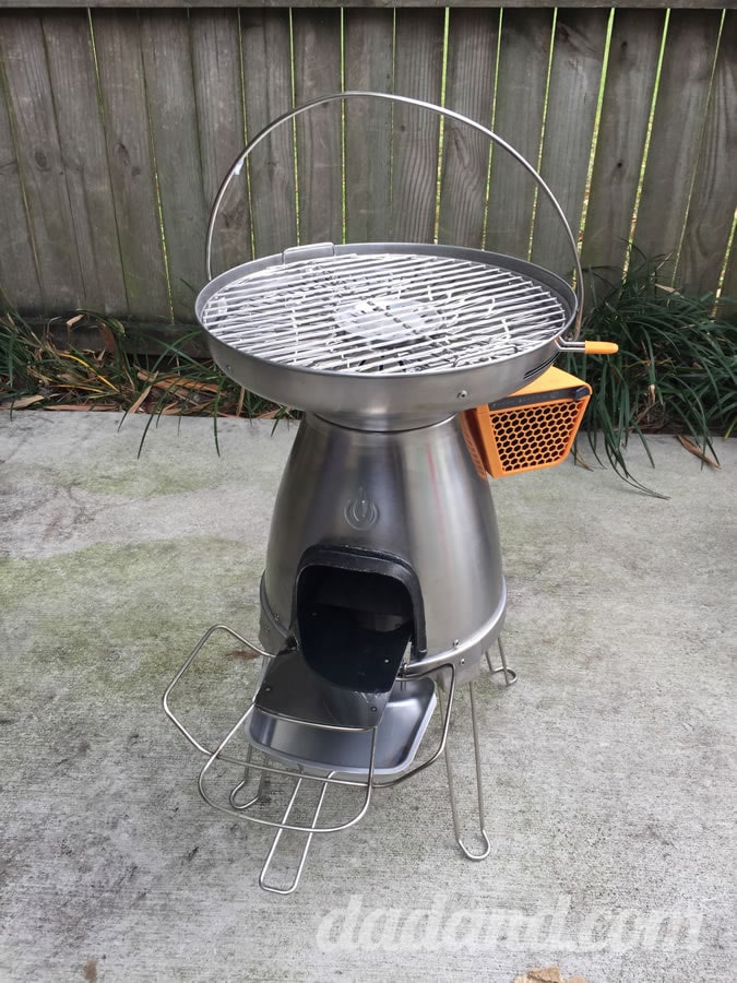 The stove is easy to carry and setup with the nice big handle at the top. Two attachments allow you to support logs feeding in to the fire and an ash pan for cleanup. It has retractable legs like a UFO.